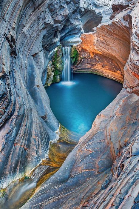 cave lake waterfall cliffs