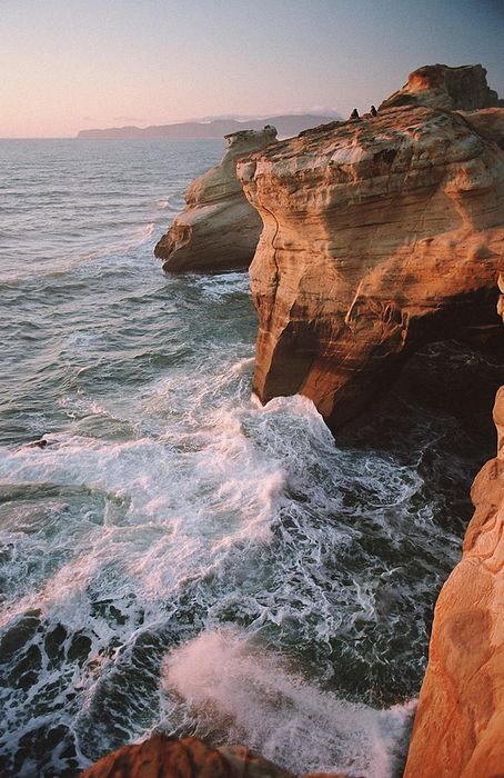 stones cliff ocean waves