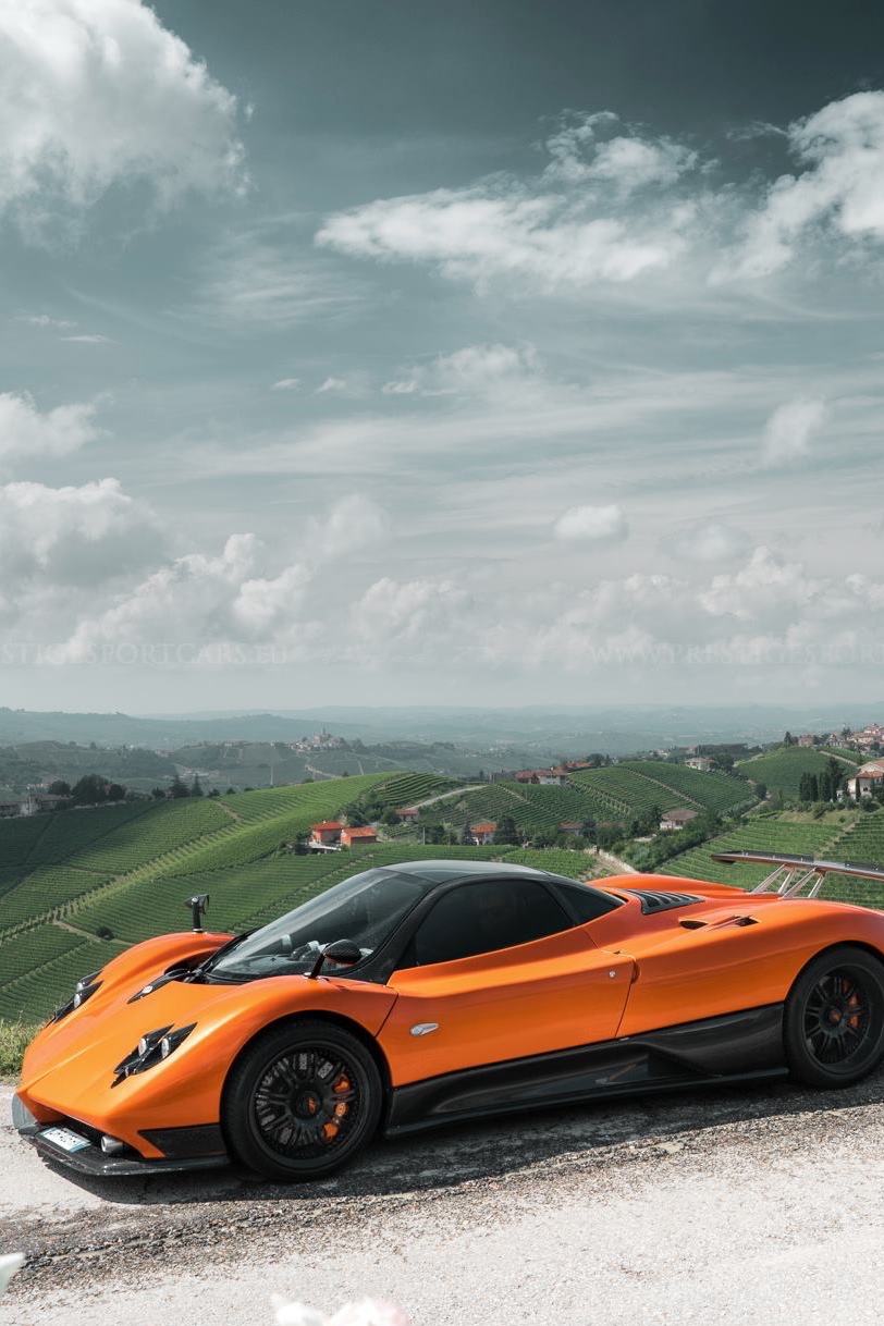 pagani zonda orange vehicle sportscar race hurry fast drive action landscape sky road